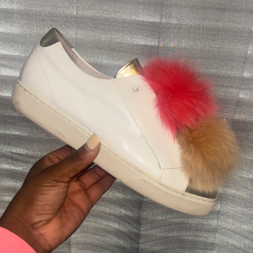 Stylish White Sneakers with Red and Tan Pom Poms